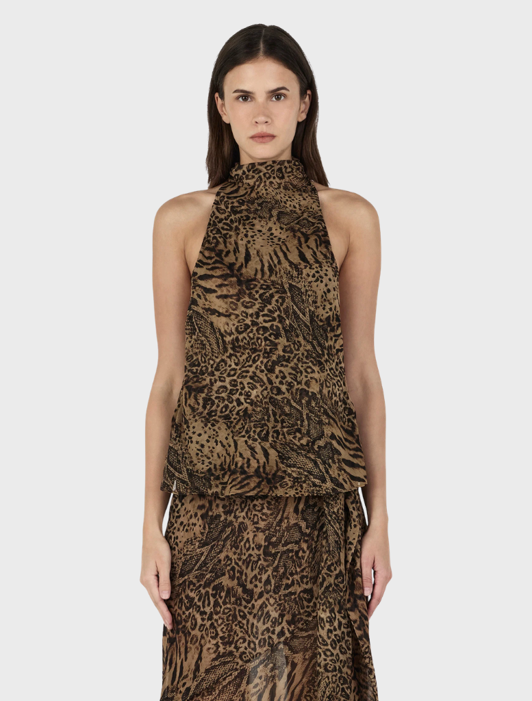 Ramona Top - Sirocco features a stylish animal print fabric, showcasing a bold and trendy design.