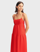 Elegant red rose midi dress with scalloped tiers, ideal for special events and warm-weather gatherings.