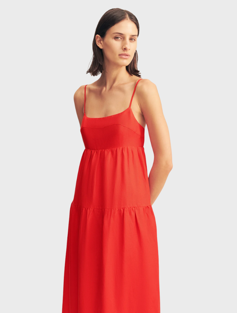 Elegant red rose midi dress with scalloped tiers, ideal for special events and warm-weather gatherings.