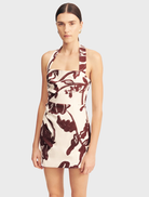 Emmett Halter Draped Mini Dress showcasing a redwood wallpaper print, designed with a halter neck and elegant draping.