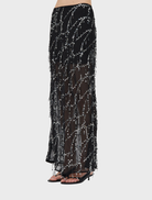Black maxi skirt with a graceful bias cut, ideal for adding sophistication to any wardrobe.
