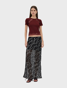 Black maxi skirt with a flowing design, featuring a subtle bias cut for a stylish and elegant look.