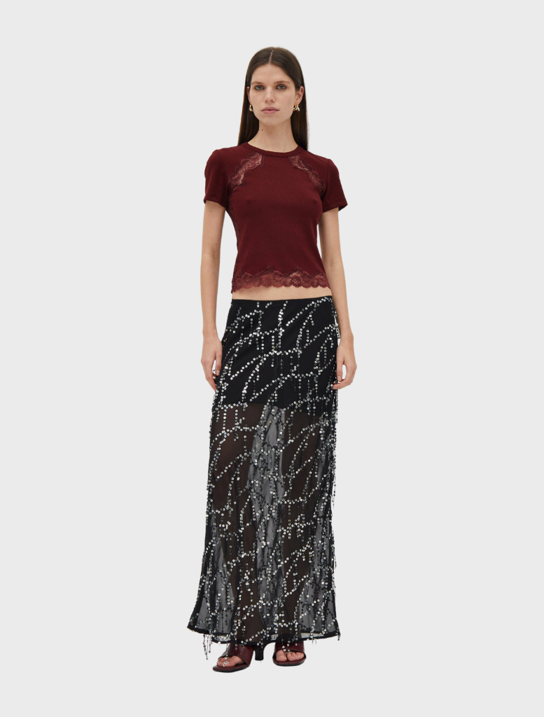 Black maxi skirt with a flowing design, featuring a subtle bias cut for a stylish and elegant look.