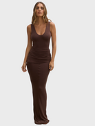 A model showcases a brown dress featuring a stylish v neckline.