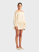 Stylish mini dress made from a linen blend, featuring a resin hue, perfect for warm weather outings.