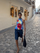 Top featuring vibrant floral designs. 