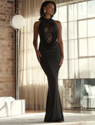 Elegant black gown by Rhianna Halter, featuring a sleek design and sophisticated silhouette.