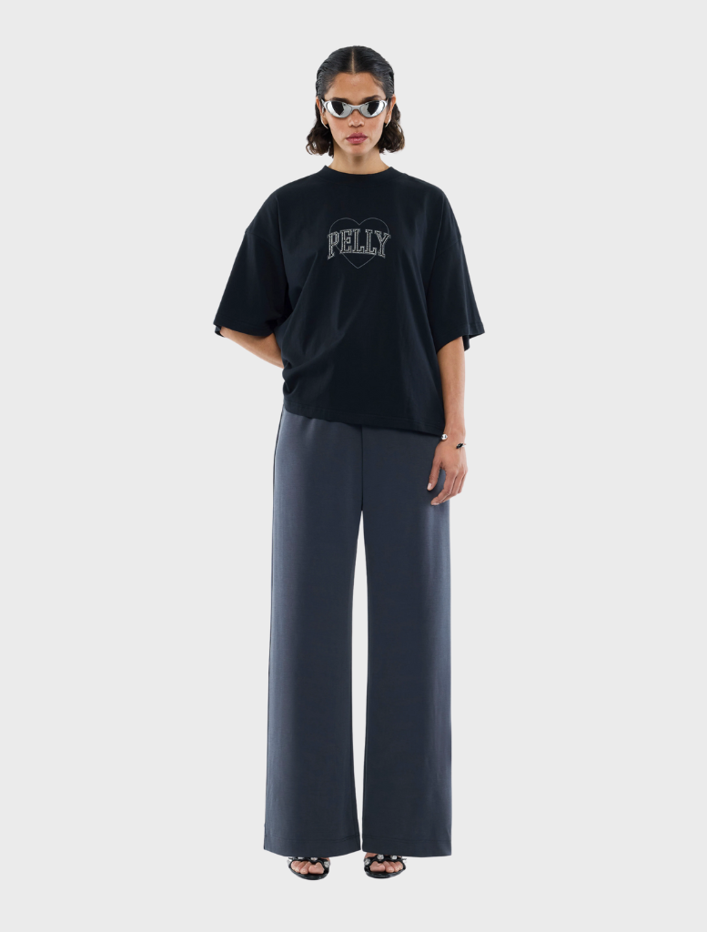 Black tee featuring a sparkling rhinestone logo, perfect for casual or stylish occasions.