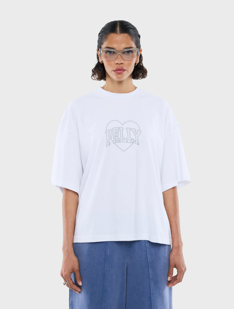 White tee featuring a sparkling rhinestone logo prominently displayed on the front.
