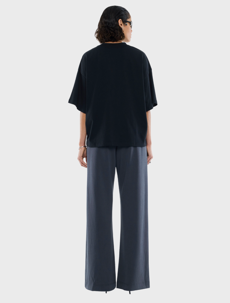  Stylish black shirt embellished with a rhinestone logo, offering a chic touch to everyday wear.