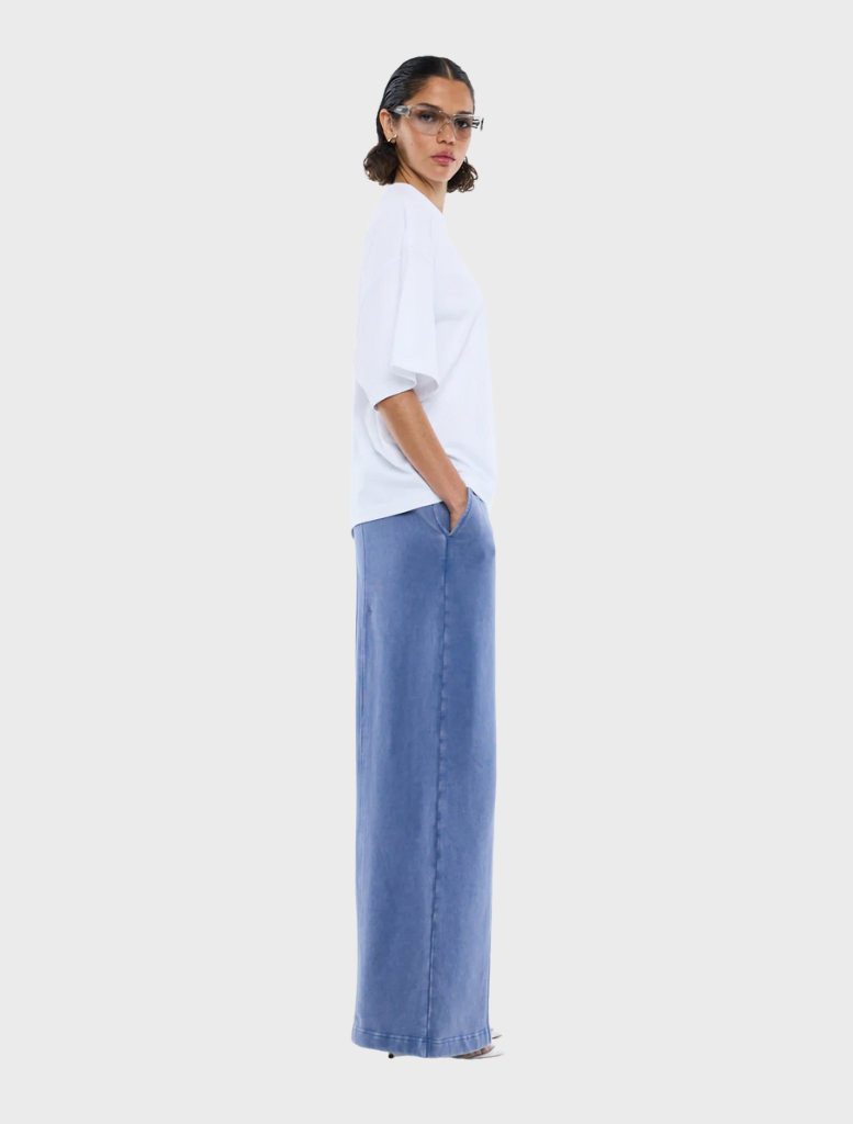 Classic white t-shirt with a decorative rhinestone logo for a trendy look.
