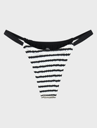 Rhodes Bottom - Selene, showcasing a serene landscape with lush greenery and a tranquil water body under a clear sky.