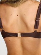 Stylish chocolate Rhodes top laid flat, illustrating its soft material and fashionable design.