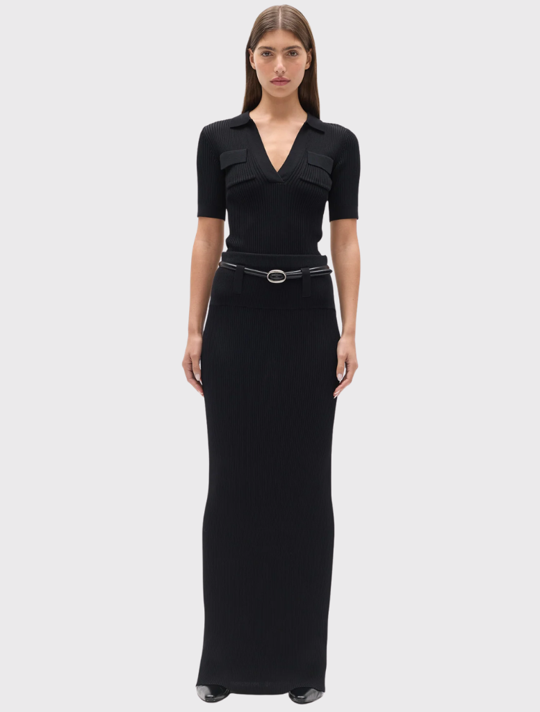 Black Rhylin Skirt featuring ribbed knit, wide waistband, belt loops, and a fitted maxi length design.