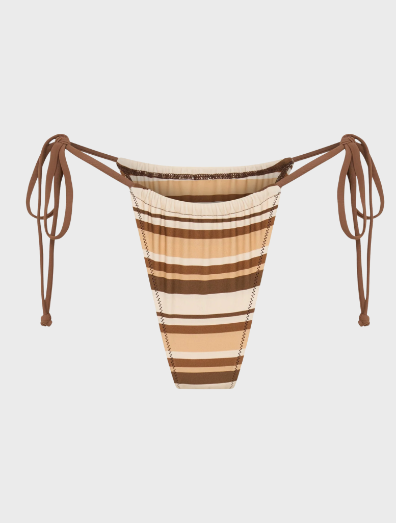 Rio Bottom - Dulce, showcasing a vibrant landscape with lush greenery and a serene river flowing through the scene.