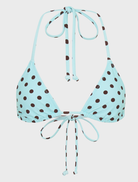 Blue polka dot Rio top displayed on a hanger, showcasing its vibrant pattern and stylish design.