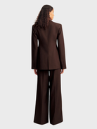 A stylish double-breasted blazer in Ristretto color, featuring a tailored fit and elegant design for formal occasions.