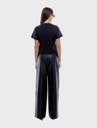 Stylish black leather pants with a slim fit, offering a versatile addition to any wardrobe for various occasions.