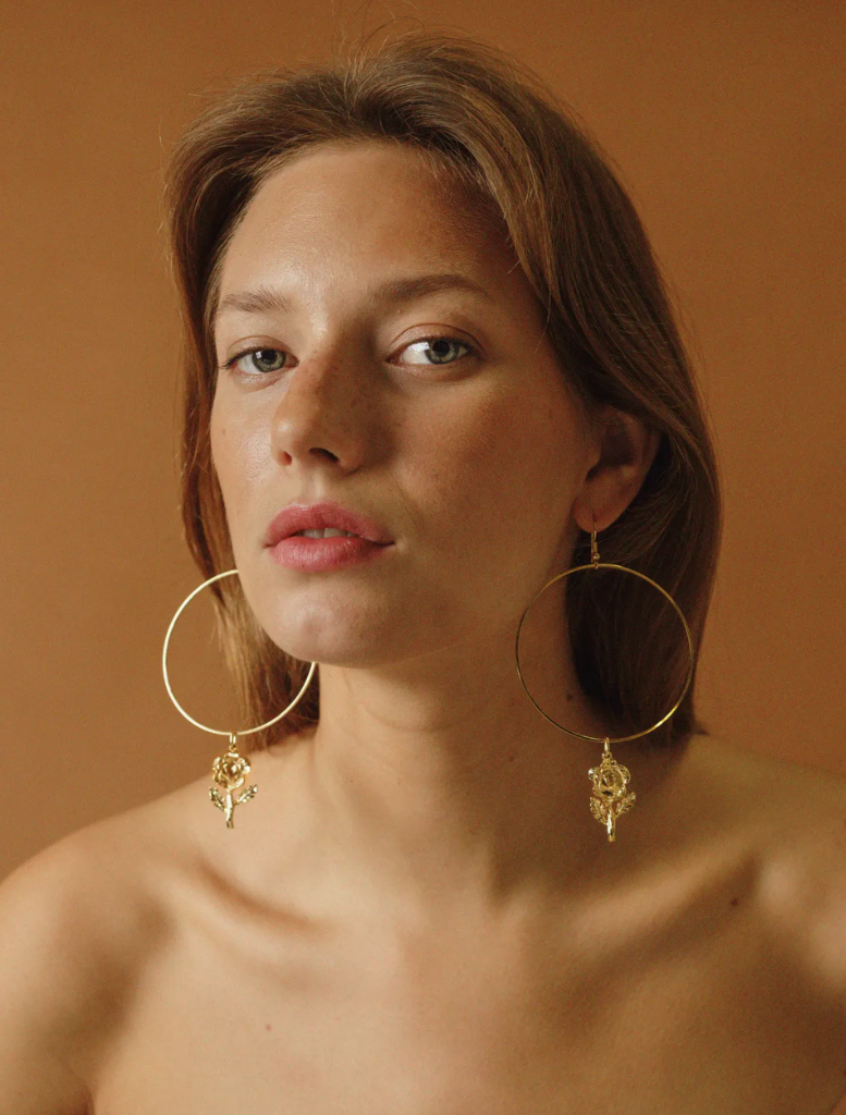 Rosa Linda Earrings: gold hoop earrings embellished with a charming rose design.