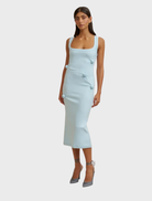 Ice blue stretch crepe midi dress featuring tucks and a 3D rosette, designed with an invisible zip closure at the back.