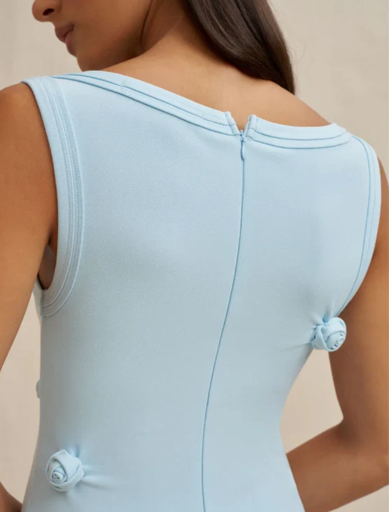 Elegant ice blue midi dress in stretch crepe, showcasing hand-placed tucks and a 3D rosette, with an invisible back zip.