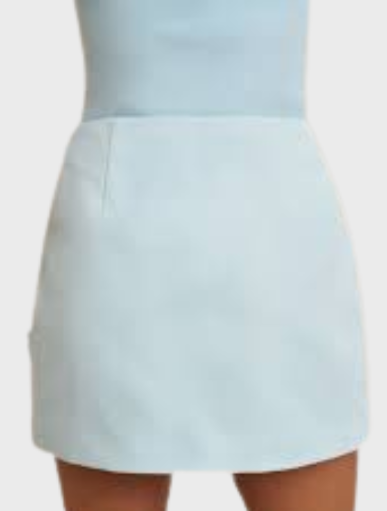 A-line mini skirt in ice blue, showcasing handmade rosettes on the front, constructed from structured twill and fully lined.