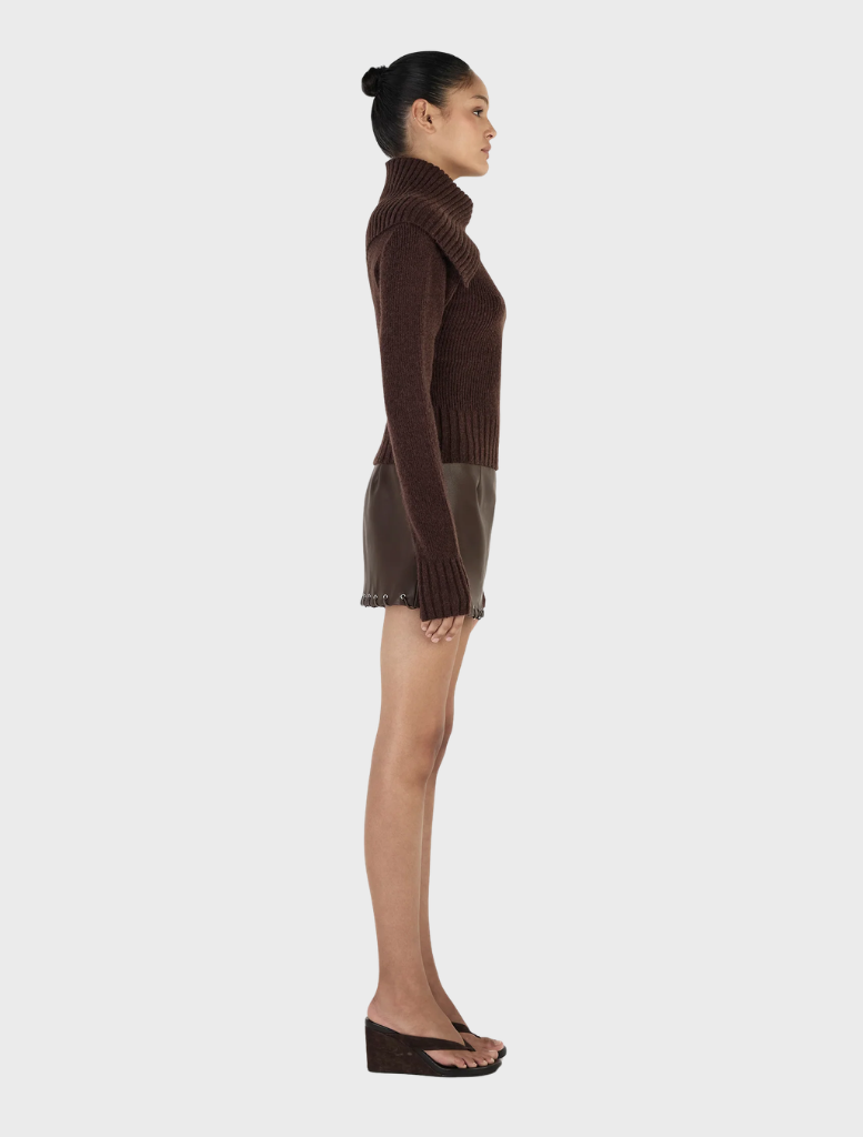 A chocolate-colored Roxanne turtleneck, illustrating its modern style and comfortable fabric, against a minimalistic background.