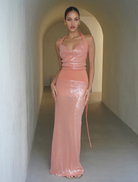 Rtw Lilou Dress in coral, featuring a flowing design and elegant silhouette, perfect for summer occasions.