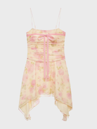 Delightful soft yellow mini dress with a sleek design and adjustable straps, great for summer parties or outings.