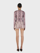 Mauve long sleeve top featuring a stylish snake print design, perfect for casual or dressy occasions.