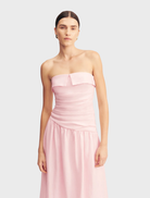 Gigi Strapless Maxi Dress, adorned with a Sakura floral pattern, showcasing a chic and elegant design perfect for warm weather.