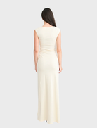 Beautiful butter Samara gown, featuring a refined silhouette and gentle draping, perfect for evening wear or formal gatherings.
