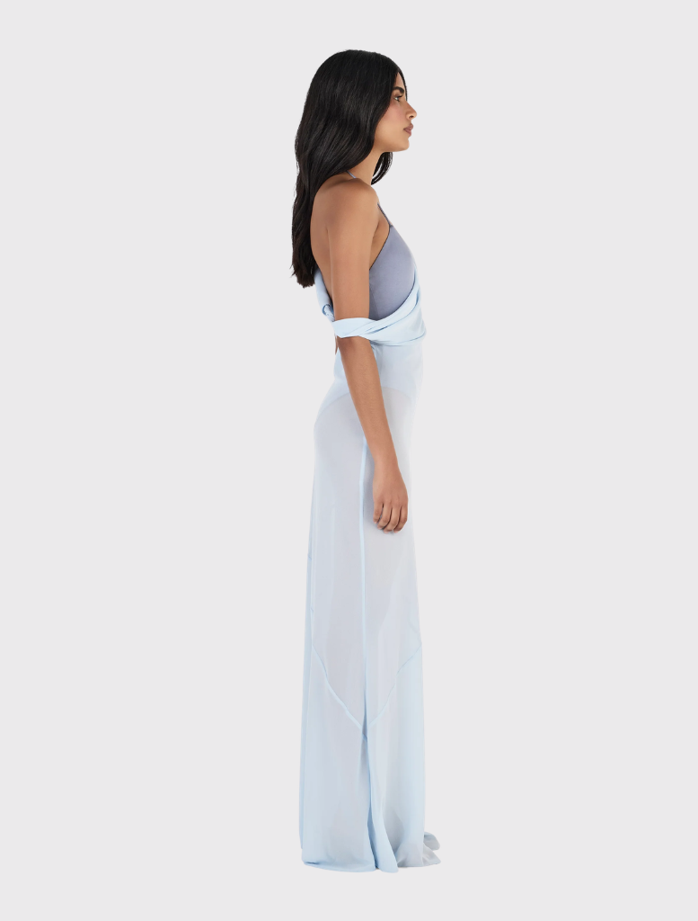 Full-length Sandra Maxi Dress in cornflower blue, designed with adjustable straps and a deep cowl neckline for versatility.