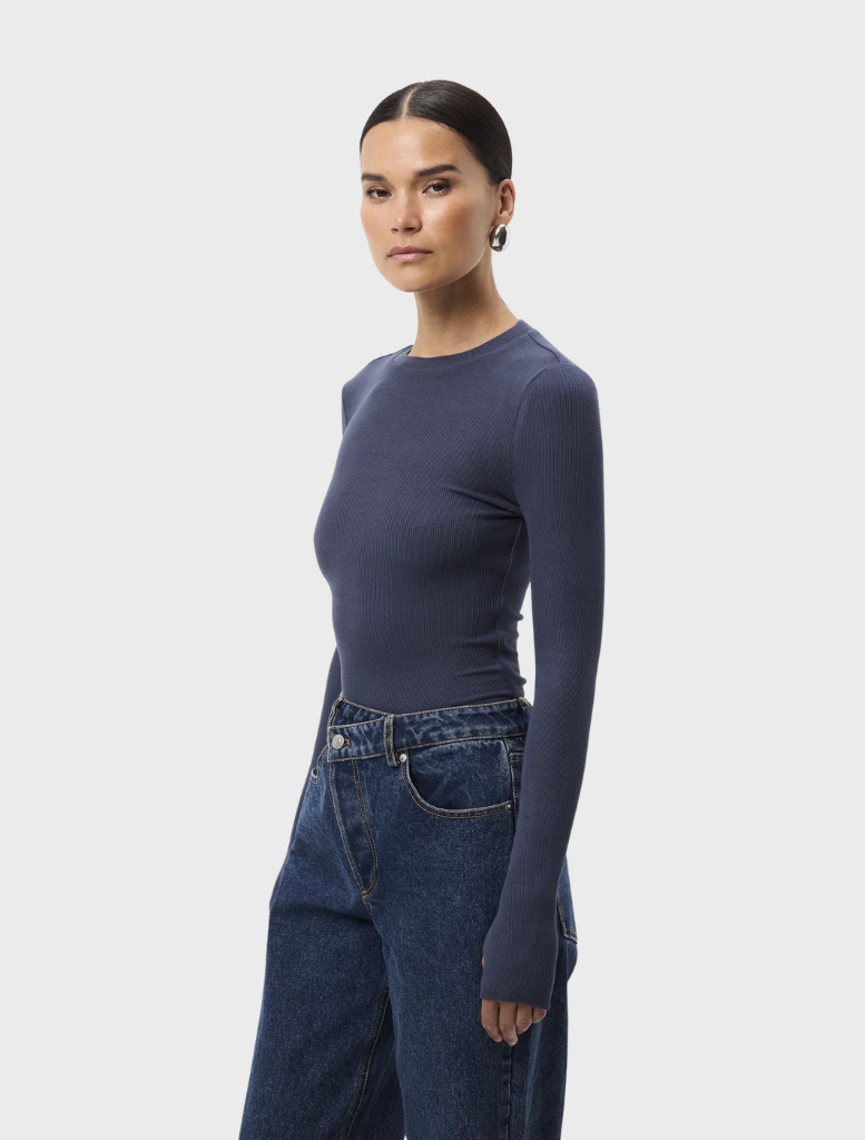 The Brooklyn Top in sapphire, featuring a contemporary design, displayed against a neutral background for contrast.