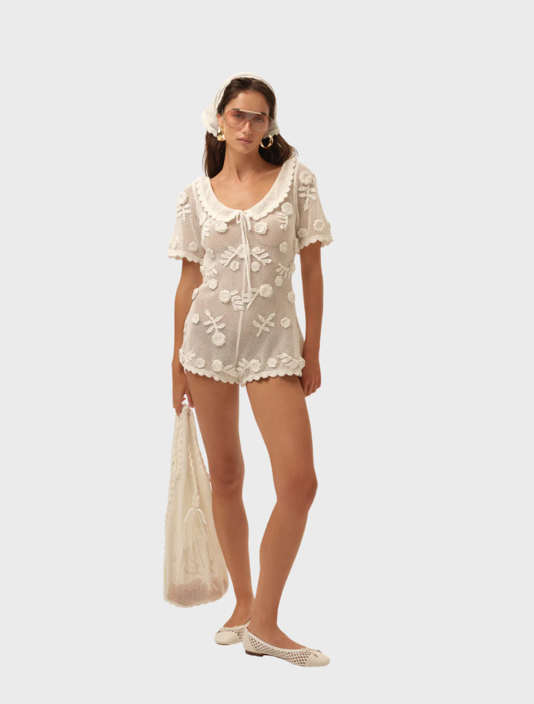Stylish white Sara romper designed for comfort and versatility, perfect for summer wear.
