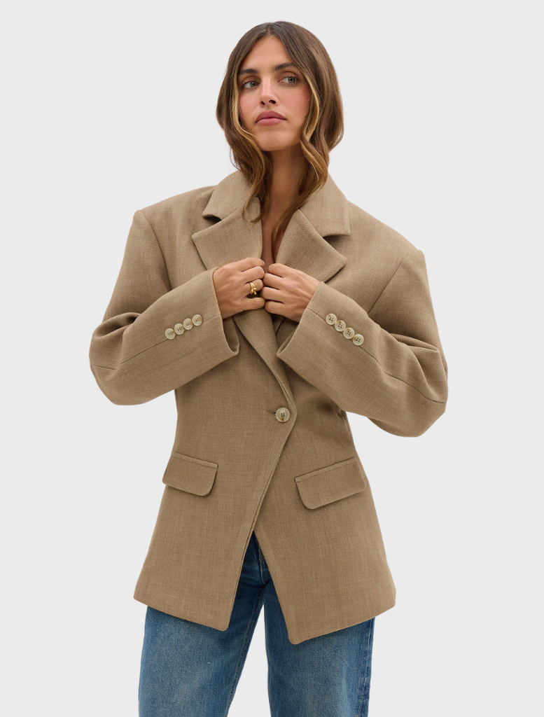 Chic caramel Saskia cinched blazer with a defined waist and structured design, suitable for both work and social events.