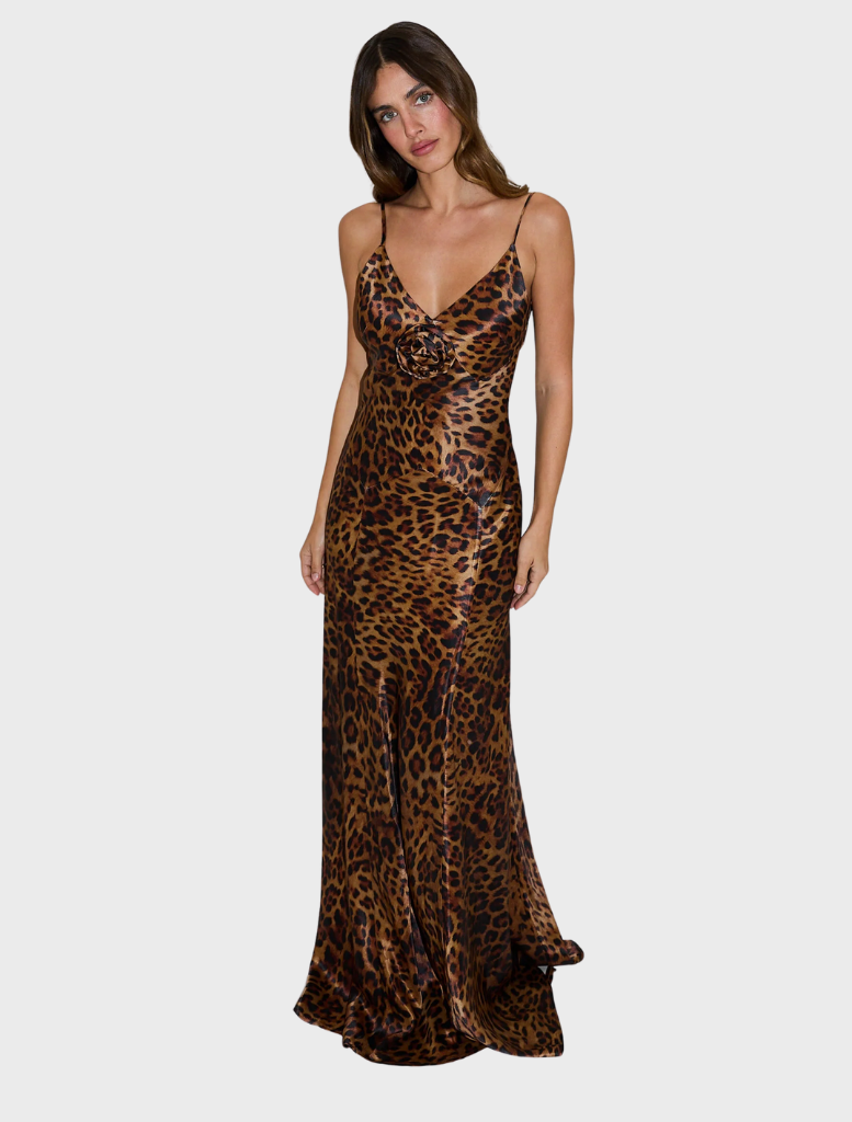 Elegant Savannah Rosette Gown in a bold leopard print, featuring intricate rosette detailing and a flowing silhouette.
