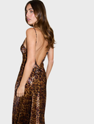 Elegant leopard print gown with a rosette design, showcasing a sophisticated and stylish silhouette.
