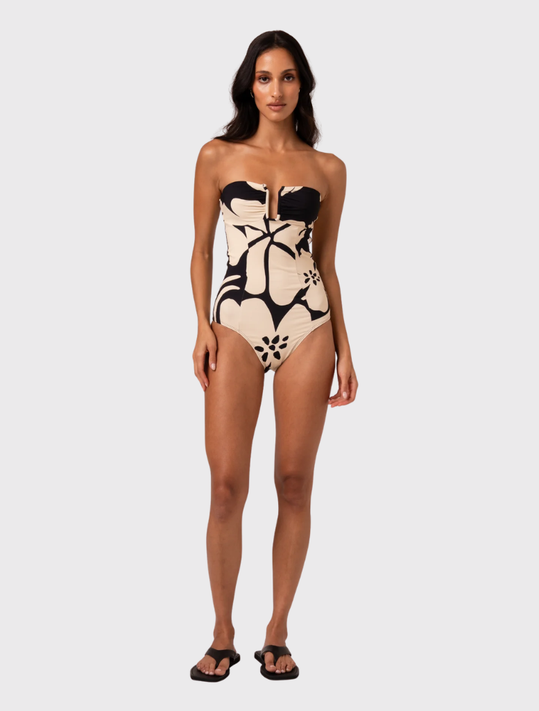 Strapless one-piece swimsuit in Botanica print, featuring a defined bust, V-wire, and vertical panel seams for a sleek look.