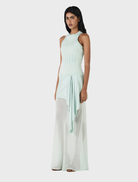 Vesper's seafoam silk skirt, offering a chic and sophisticated look with its lightweight fabric and flattering shape.