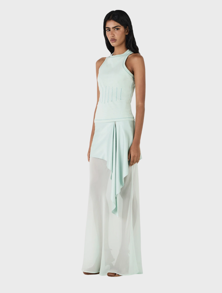 Vesper's seafoam silk skirt, offering a chic and sophisticated look with its lightweight fabric and flattering shape.