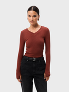 Rust-colored Sedona Top displayed on a mannequin, featuring a relaxed fit and short sleeves.