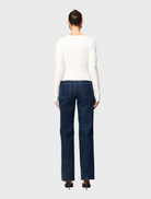 Elegant white Sedona top with short sleeves, designed for comfort and versatility in various settings.