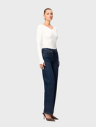 White Sedona top displayed, featuring a classic design and soft fabric, perfect for layering or standalone wear.
