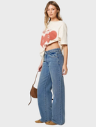 95 Mid Baggy jeans showcasing a modern, relaxed fit, reflecting Selena's iconic fashion sense and style.