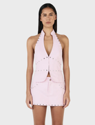 Baby pink Selma top with studded accents, combining elegance and modern fashion.