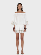 Seraphine Mini Dress featuring a delicate ditsy cross stitch pattern on a soft fabric, perfect for casual outings.