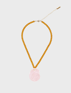 Necklace featuring a pink rose design, named Serena Necklace - Pink & Amber.