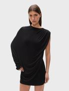 The "Birdie" bodysuit in shadow color, featuring a modern design, showcased on a plain backdrop.