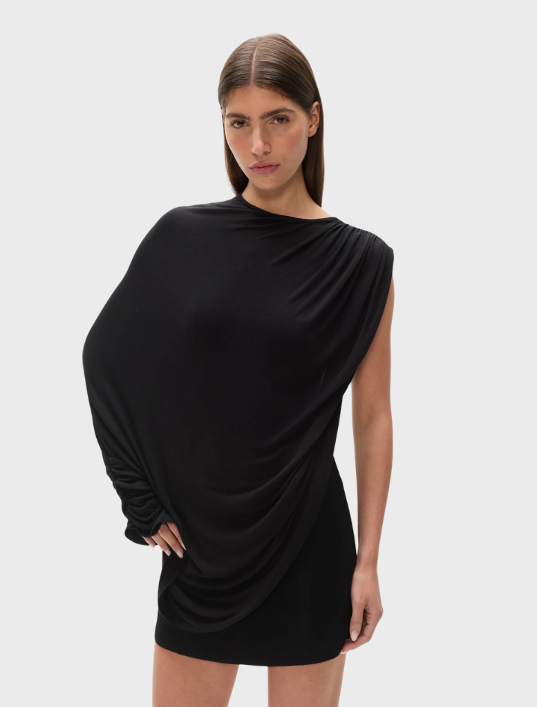 The "Birdie" bodysuit in shadow color, featuring a modern design, showcased on a plain backdrop.